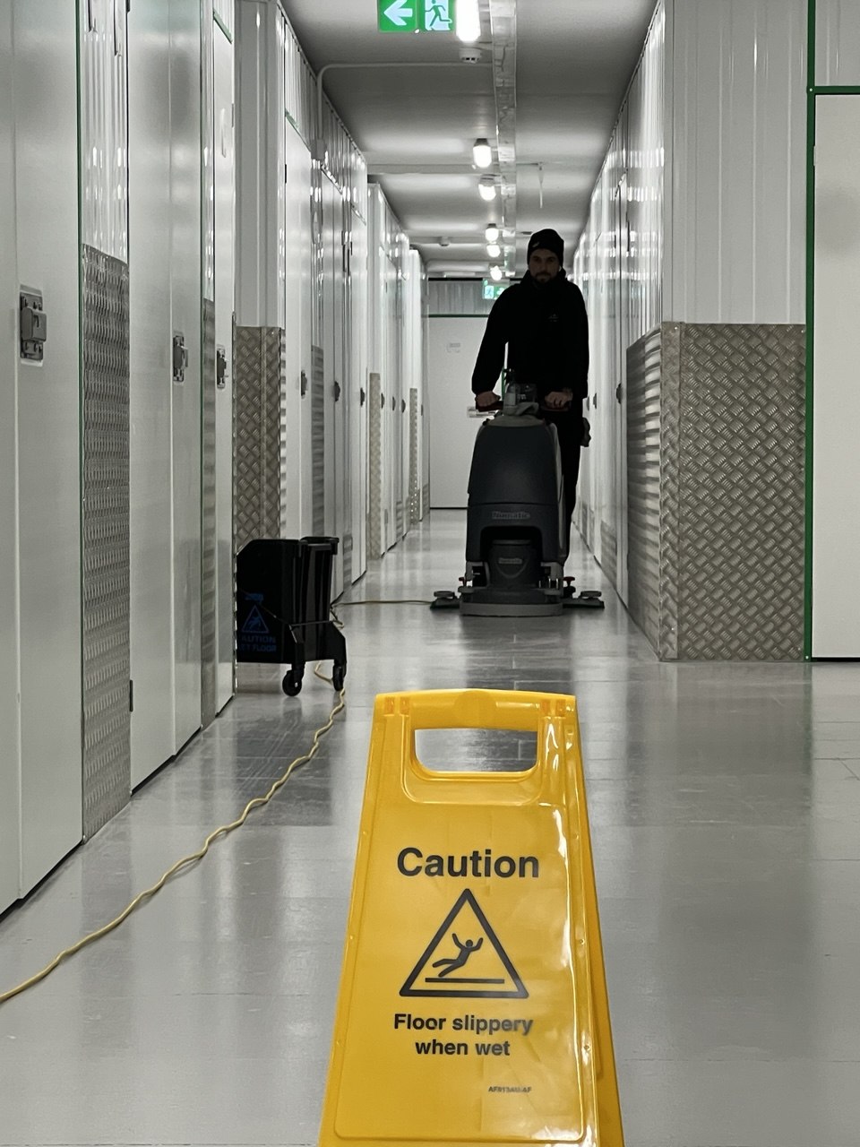 Floor cleaning machine in a commercial facility