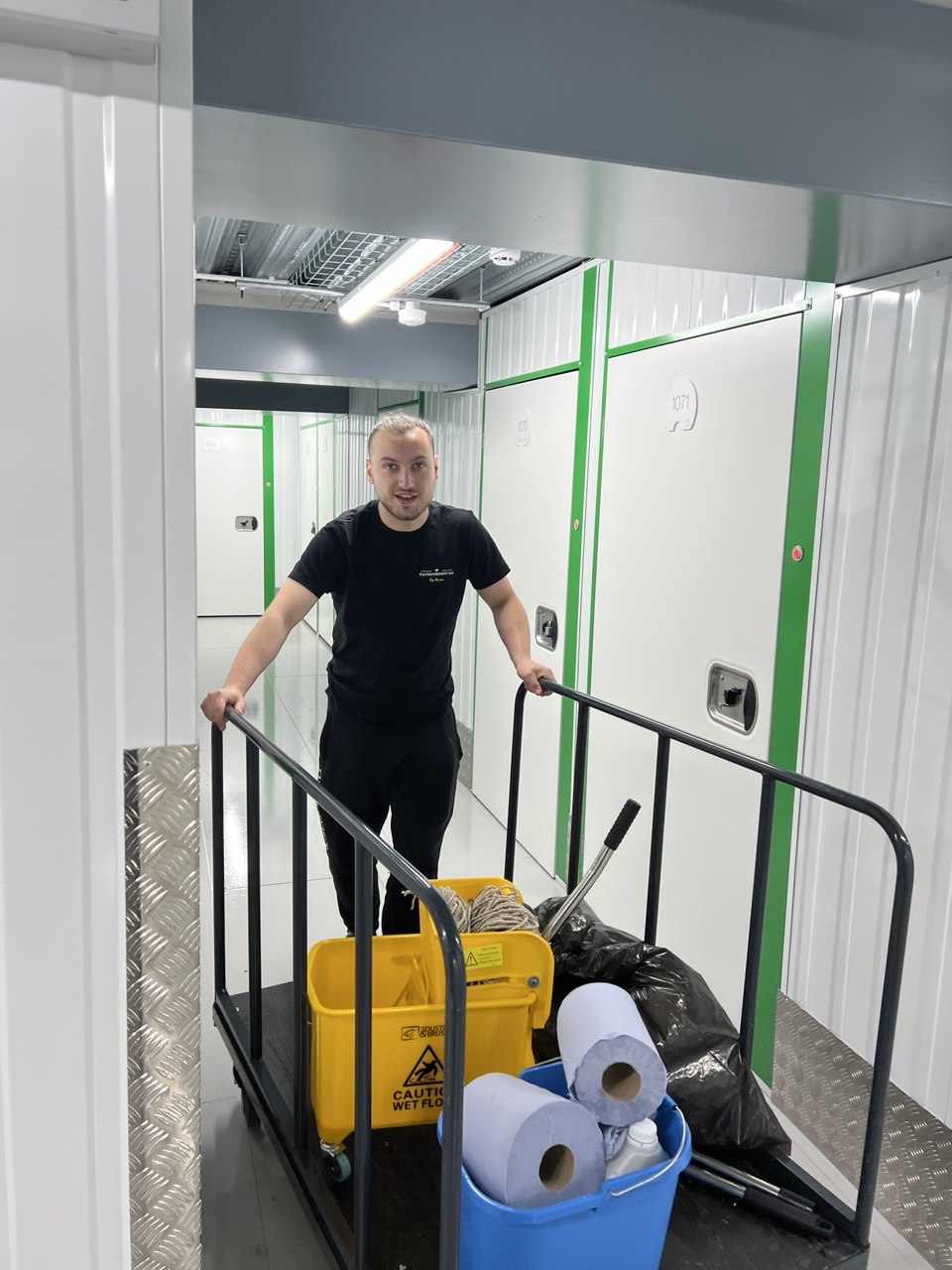 Top Men Cleaning team member with professional cleaning equipment